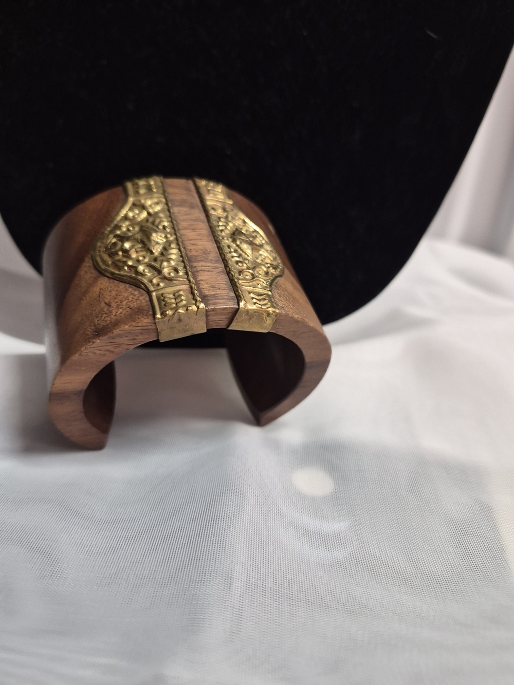 Antique wooden cuff with gold tone.
